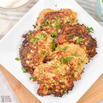 cabbage hash browns on square white plate.