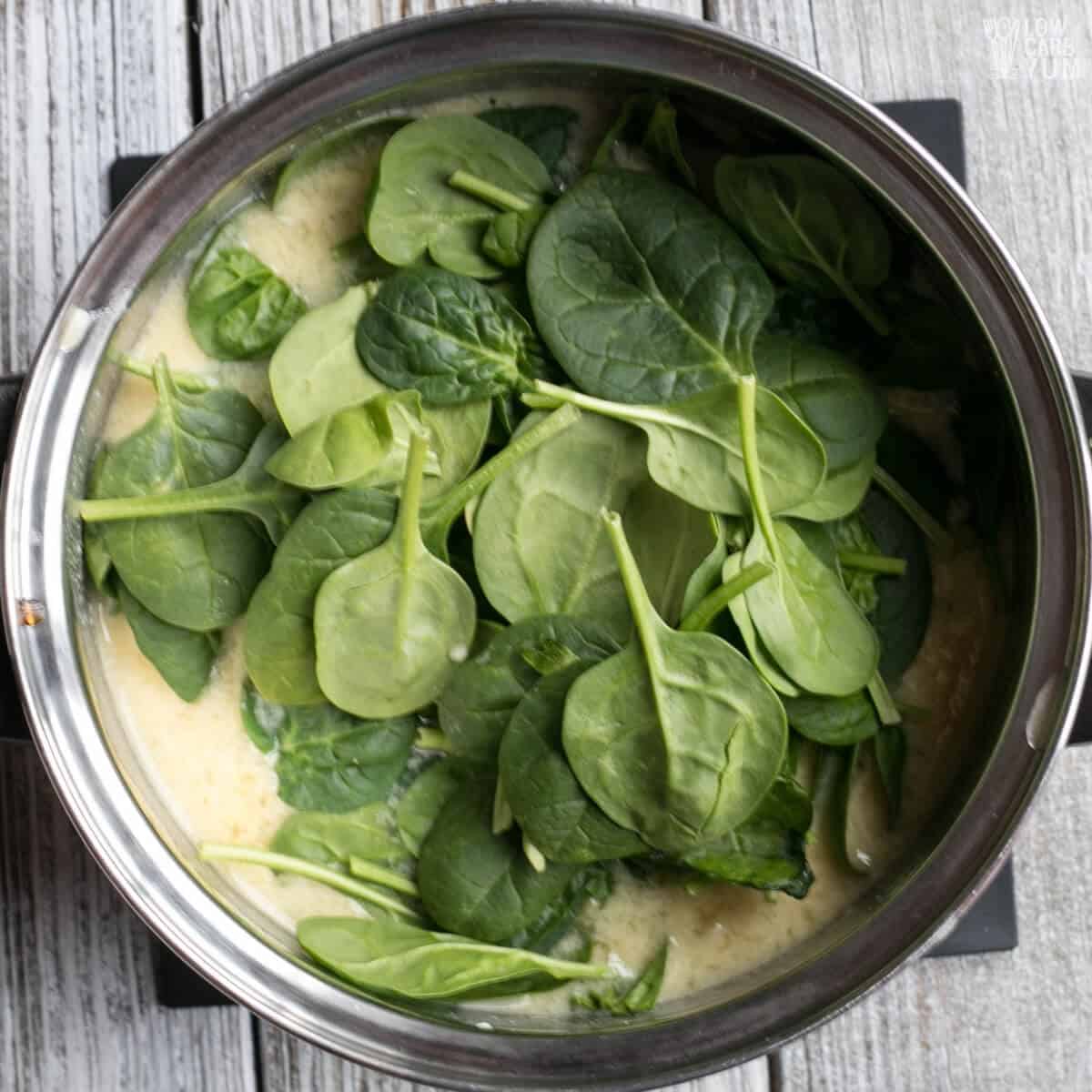 adding spinach to soup base