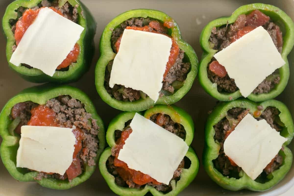 stuffing peppers and topping with cheese