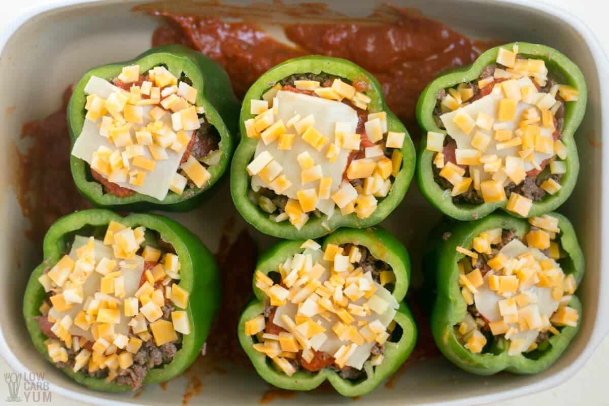 stuffed peppers with sauce in pan