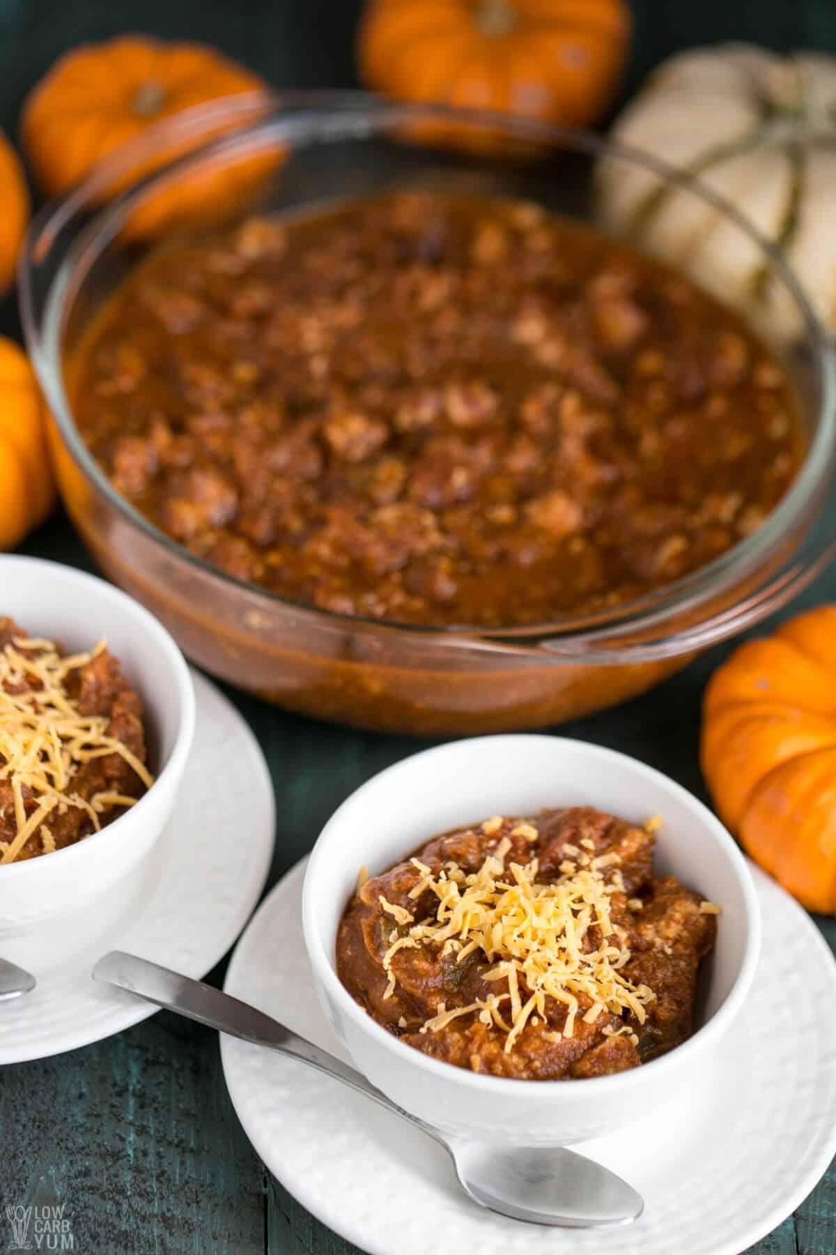 keto pumpkin chili made with ground turkey and served with grated cheese